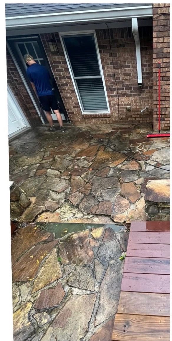 Before: Flagstone patio pressure washed